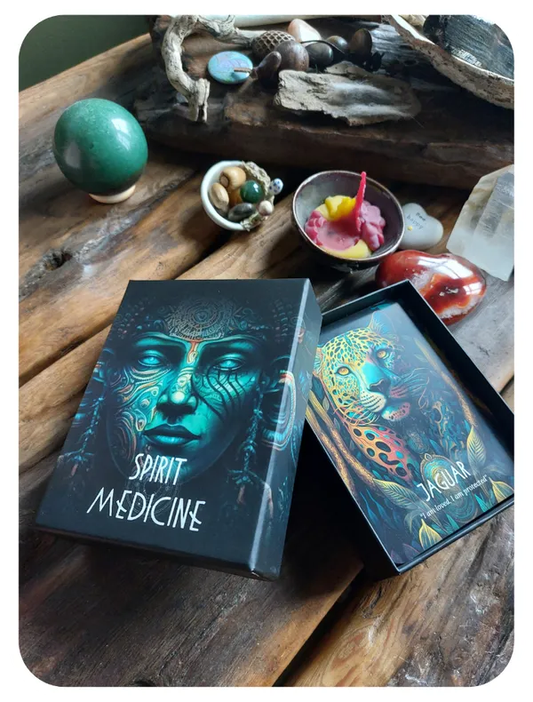 Spirit Medicine box and Jaguar card on wooden surface with crystals